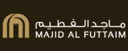 Majid Al Futtaim logo with Arabic and English text on a dark background.